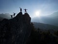 Successful climbers on the jagged cliff at the top of the mountains Royalty Free Stock Photo