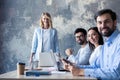 Successful company with happy workers in modern office. Royalty Free Stock Photo