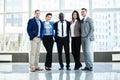 Successful company with happy workers in office. Royalty Free Stock Photo