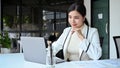 Successful and confident Asian businesswoman working on her laptop computer Royalty Free Stock Photo