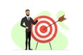 Successful contented businessman stand with target and arrow hit center. Man achieving his business or work goal concept Royalty Free Stock Photo