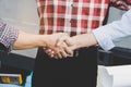 Successful deal, Female architect shaking hands with client in construction site. Royalty Free Stock Photo