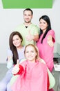 Successful dentist team and happy patient Royalty Free Stock Photo