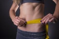 Successful diet,girl measuring her waist Royalty Free Stock Photo