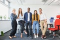 Successful diverse business people standing together at startup office Royalty Free Stock Photo