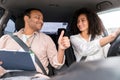 Instructor Man Gesturing Thumbs Up To Driver Woman Driving Car Royalty Free Stock Photo