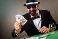 Elegant gambler playing poker