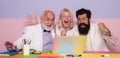 Successful entrepreneurs and business people. Funny excited group of businesspeople working on a laptop at a table in an Royalty Free Stock Photo