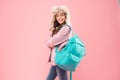 Successful Everyday. kid warm clothes pink background. happy child earflap hat. schoolgirl with backpack. end of school Royalty Free Stock Photo