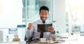 Successful and excited business man cheering with joy while working on digital tablet in an office. Happy trader and Royalty Free Stock Photo