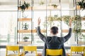 Successful excited business man happy smile hold fist gesture view from back, handsome young businessman with raised hands arms. Royalty Free Stock Photo