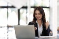 Successful and exciting businesswoman Young woman excited to win on her smartphone at work Royalty Free Stock Photo