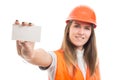 Successful female engineer showing blank visit card Royalty Free Stock Photo