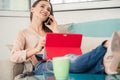 Successful female entrepreneur talking on mobile phone in a co-working space Royalty Free Stock Photo