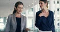 Successful female leaders and business women talking, walking into office building for a meeting. Mentors and executives