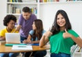 Successful female student with group of multi ehtnic students Royalty Free Stock Photo