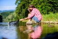 Successful fisherman in lake water. big game fishing. relax on nature. hipster fishing with spoon-bait. mature bearded Royalty Free Stock Photo