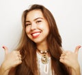 Successful girl gives thumb up with two hands Royalty Free Stock Photo