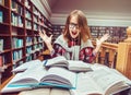Successful Girl Studying Hard in Library Royalty Free Stock Photo