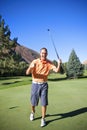 Successful Golfer Making Putt Royalty Free Stock Photo