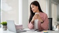 A successful Asian businesswoman working on her business work on laptop at her desk Royalty Free Stock Photo