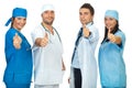 Successful group of doctors giving thumbs