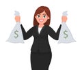 Successful happy businesswoman holding cash/money or currency bags in hands. Business and finance concept.