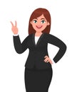 Successful happy businesswoman showing / gesturing V, victory or peace sign. Businesswoman showing two fingers. Royalty Free Stock Photo