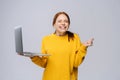 Successful happy shocked young woman with closed eyes holding laptop computer Royalty Free Stock Photo