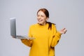 Successful happy shocked young woman with closed eyes holding laptop computer Royalty Free Stock Photo