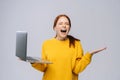 Successful happy shocked young woman with closed eyes holding laptop computer Royalty Free Stock Photo