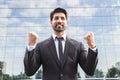 Successful businessman or worker standing in suit near office building Royalty Free Stock Photo