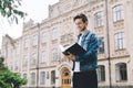 Successful happy students standing near campus or university outside Royalty Free Stock Photo