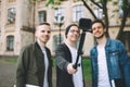 Successful happy students standing near campus or university outside Royalty Free Stock Photo