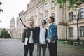 Successful happy students standing near campus or university outside Royalty Free Stock Photo