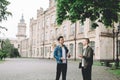 Successful happy students standing near campus or university outside Royalty Free Stock Photo