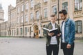 Successful happy students standing near campus or university outside Royalty Free Stock Photo