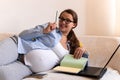 Successful hardworking Pregnant business Woman With Laptop. Young Ledy In Pregnancy came up with an idea Work paperwork