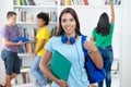 Successful hispanic female student after exam showing thumb up Royalty Free Stock Photo