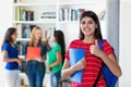 Successful hispanic female student with group of multi ethnic college students Royalty Free Stock Photo