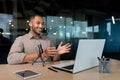 Successful hispanic man inside office with professional microphone recording audiobook and online podcast, business Royalty Free Stock Photo