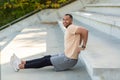 Successful hispanic sportsman doing various physical exercises, morning workout at the stadium, man motivationally