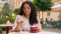 Successful Indian Arabian woman ethnic female girl businesswoman looking mobile phone drinking cup coffee morning Royalty Free Stock Photo