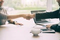 Successful job Asian businessman and businesswoman shaking hands in board room when finishing up a meeting Royalty Free Stock Photo