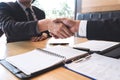 Successful job interview with boss and employee shaking hands after negotiation or interview, career and placement concept