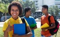 Successful latin american female student with friends Royalty Free Stock Photo