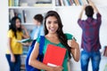 Successful latin american female student with group of students Royalty Free Stock Photo