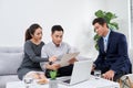 Successful lawyer giving consultation to family couple about buying house Royalty Free Stock Photo