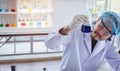 A successful male chemist is examining his new innovation in a laboratory. Royalty Free Stock Photo