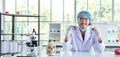 A successful male chemist is examining his new innovation in a laboratory. Royalty Free Stock Photo